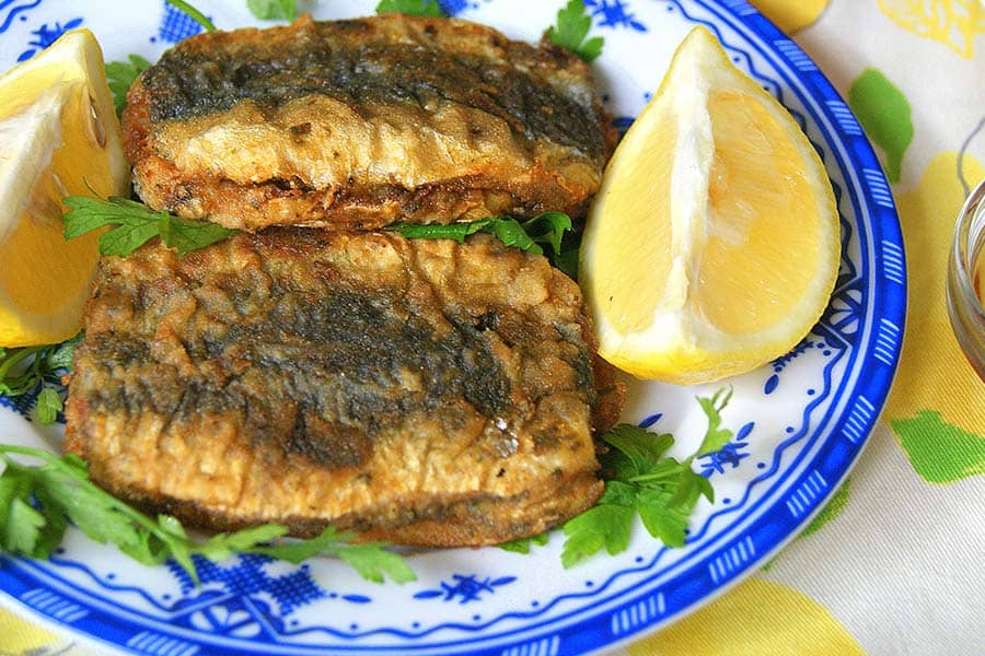 Fried stuffed sardines with lemon