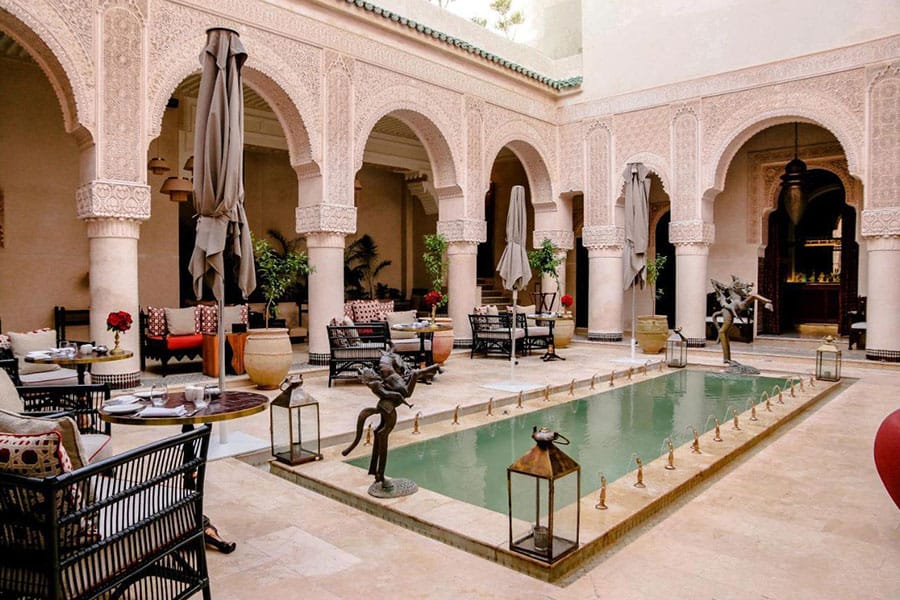 Moroccan riad patio with a pool