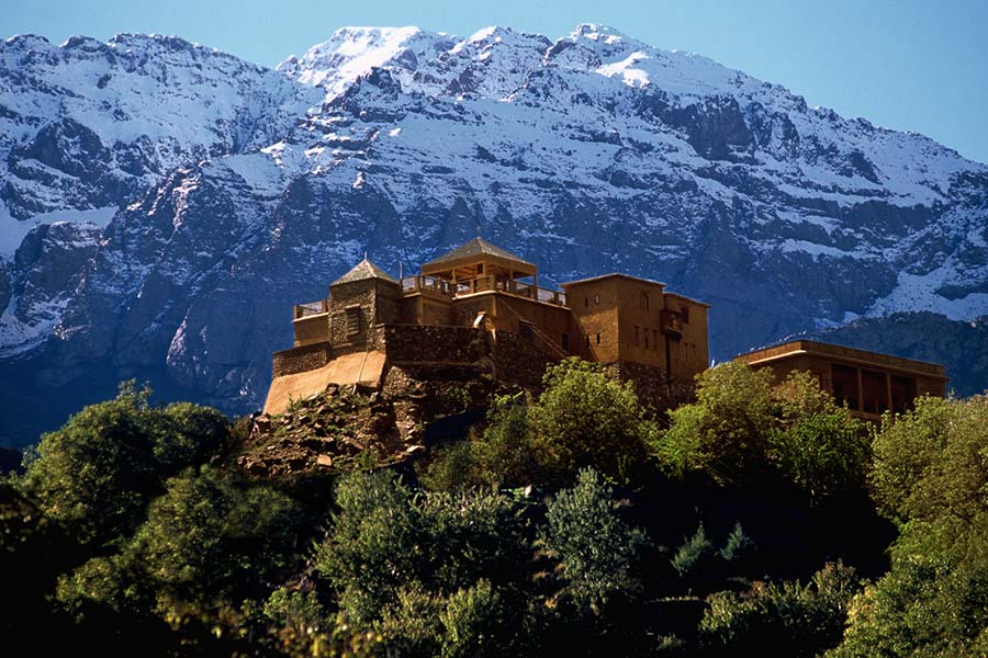 Kasbah du Toubkal with the snowy Mount Toubkal in the backdrop