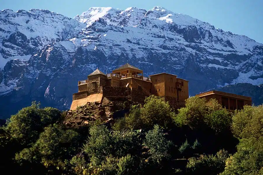 Kasbah du Toubkal with the snowy Mount Toubkal in the backdrop