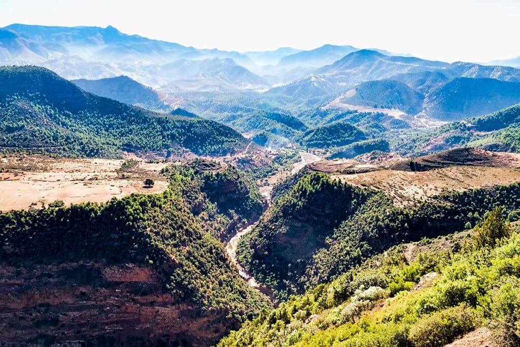 Aerial view of the lush green valleys and rugged peaks in the Atlas Mountains, Morocco
