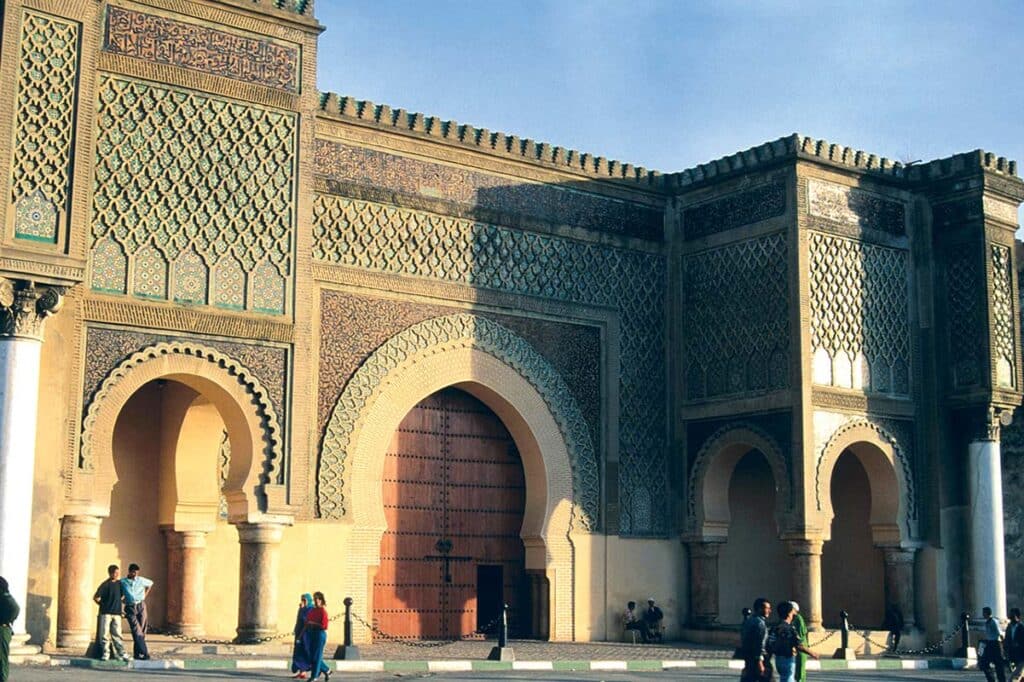Bab Mansour Gate in Meknes, Morocco, with intricate zellige tilework and arches
