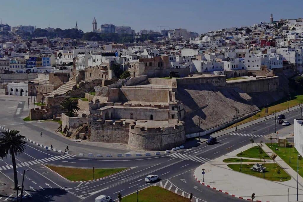 Aerial daylight view of Tangier’s medina ramparts and Borj Dar Baroud fortress above the modern Cornich