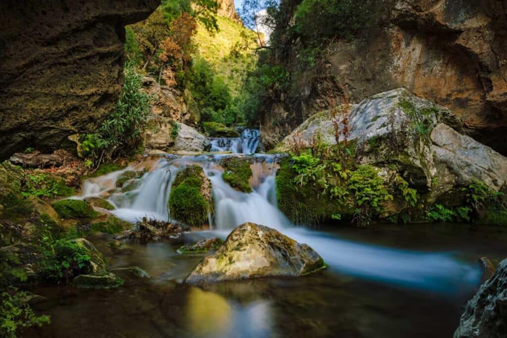 Moss‑covered cascade and clear pool in Talassemtane National Park near Chefchaouen, Rif Mountains, Northern Morocco