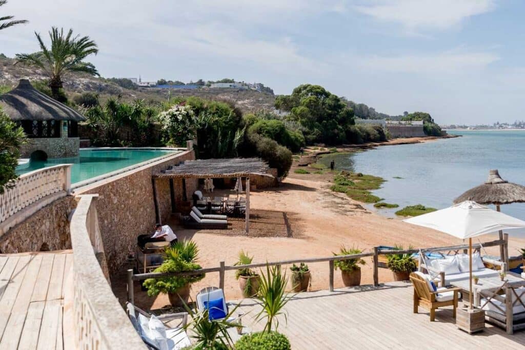 Lagoon front deck and infinity pool at La Sultana Oualidia boutique hotel